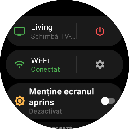 Meniul ceasului cu Roku-ul activ și scurtătura Schimbă TV-ul lângă un buton roșu de pornire